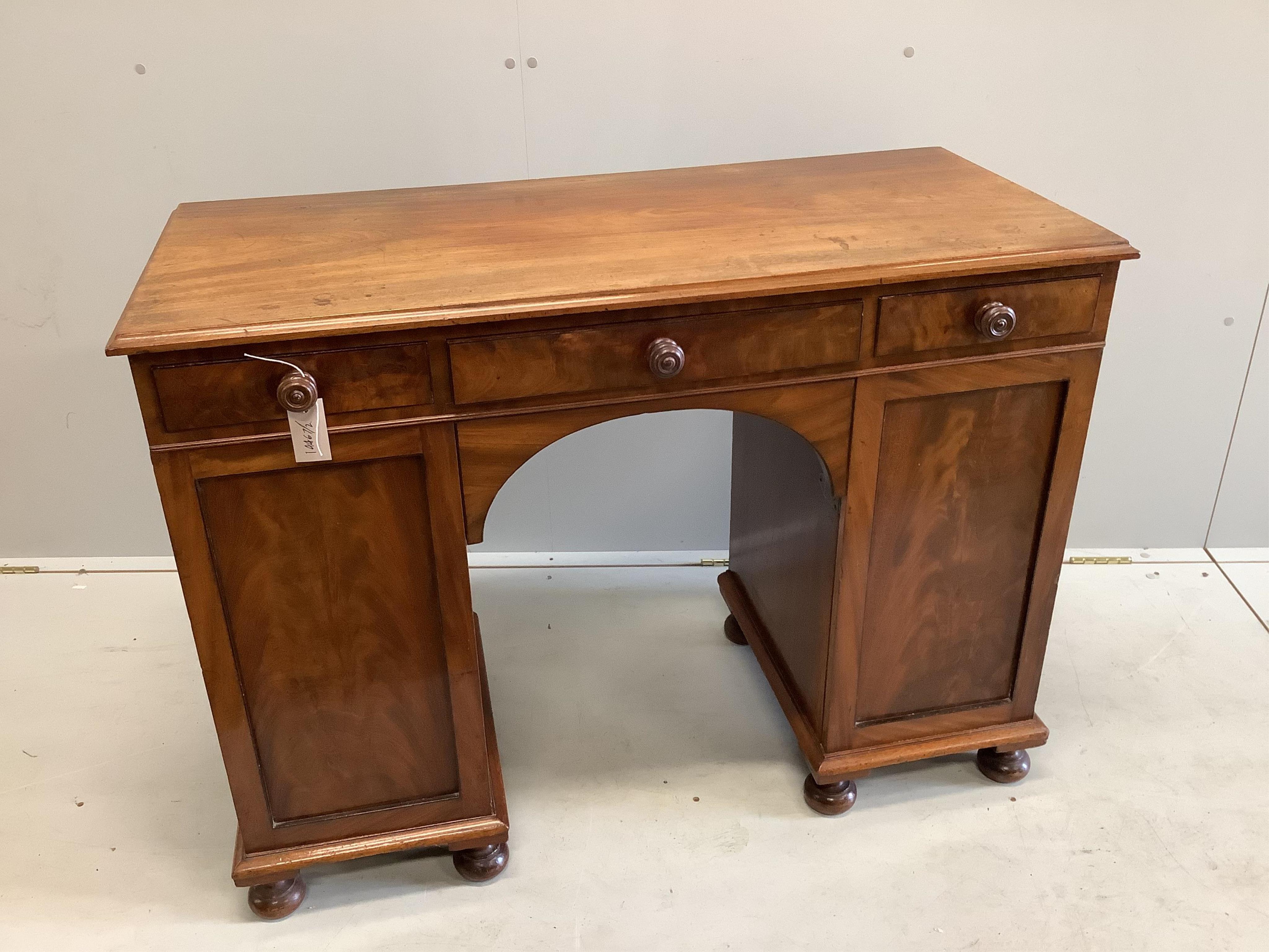 An early Victorian mahogany kneehole dressing table, width 107cm, depth 48cm, height 79cm. Condition - fair
